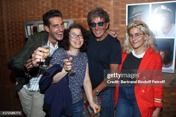 Photographer Tony Frank poses with his children Billy, Charlotte and Sarah-Lee during the "Hugues Aufray by Tony Frank" : Exhibition for the singer's...