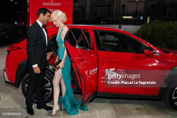Andrea Riseborough and a guest arrive on the red carpet ahead of the "ZeroZeroZero" screening during the 76th Venice Film Festival at Sala Grande on...