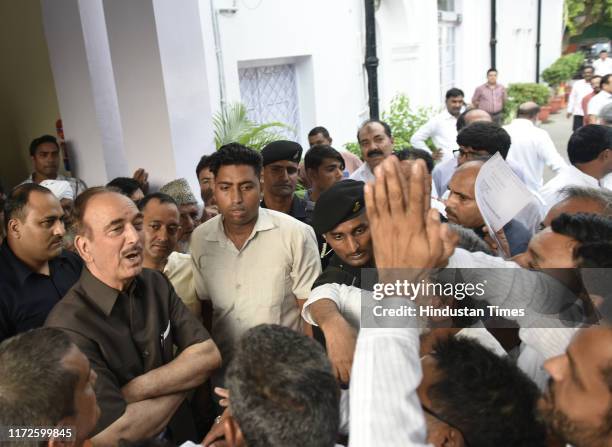 Senior Congress leader Ghulam Nabi Azad is surrounded by ticket seekers from Haryana where state elections are due, month after his briefing to the...