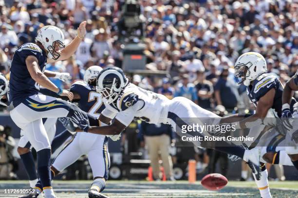 Rams linebacker Cory Littleton blocks the punt attempt of Chargers punter Drew Kaser, resulting in a second quarter Rams touchdown at the LA Memorial...