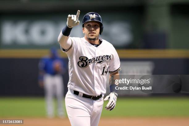 Hernan Perez of the Milwaukee Brewers rounds the bases after hitting a home run in the second inning against the Chicago Cubs at Miller Park on...