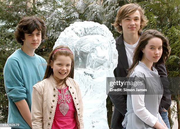 Skandar Keynes, Georgia Henley, William Moseley and Anna Popplewell alongside a lifesize ice sculpture of Aslan.
