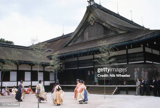 Queen Elizabeth II watches an exhibition of kemari, a traditional Japanese version of football at Imperial palace in Kyoto during Royal Tour of Japan...