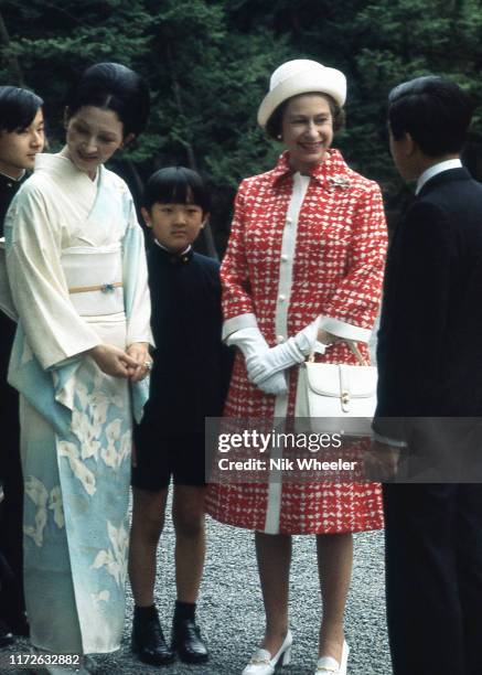 Queen Elizabeth II talks with Crown Prince Akihito and Crown Princess Michiko and their children during her one and only visit to Japan in 1975