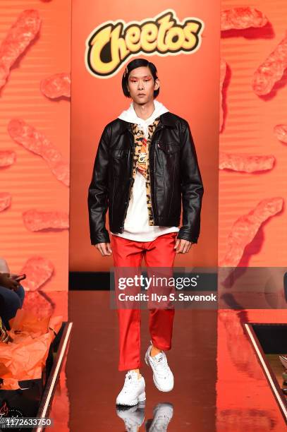 Model walks the runway as Cheetos unveiled fan-inspired versions of the #CheetosFlaminHaute look at The House Of Flamin' Haute Runway Show + Style...