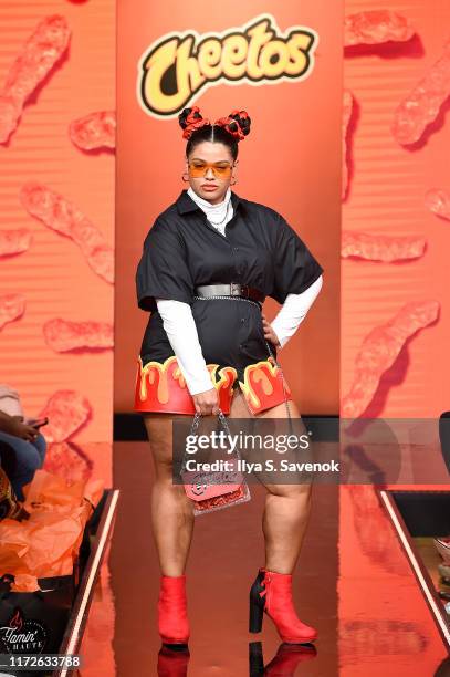 Model walks the runway as Cheetos unveiled fan-inspired versions of the #CheetosFlaminHaute look at The House Of Flamin' Haute Runway Show + Style...