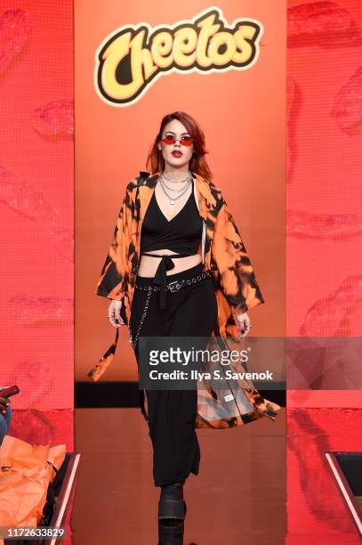 Luanna walks the runway as Cheetos unveiled fan-inspired versions of the #CheetosFlaminHaute look at The House Of Flamin' Haute Runway Show + Style...