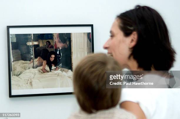 Princess Alexandra of Greece with her son Darius look at a photo of Princess Alexandra's mother