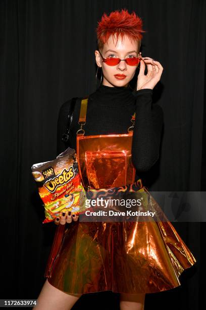 Model poses backstage as Cheetos unveiled fan-inspired versions of the #CheetosFlaminHaute look at The House Of Flamin' Haute Runway Show + Style Bar...