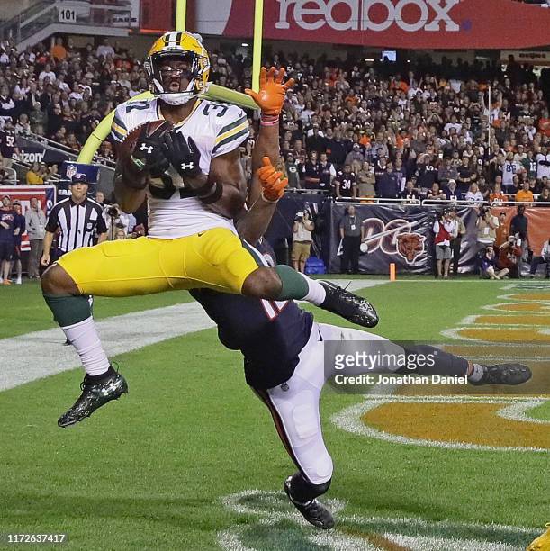 Adrian Amos of the Green Bay Packers intercepts a pass in the end zone over Allen Robinson of the Chicago Bears at Soldier Field on September 05,...