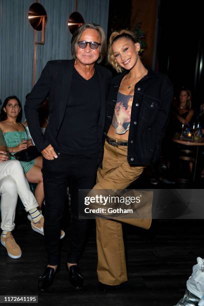 Mohamed Hadid and Bella Hadid attend La Detresse SS20 'Acid Drop' by Alana Hadid and Emily Perlstein at The Fleur Room on September 05, 2019 in New...