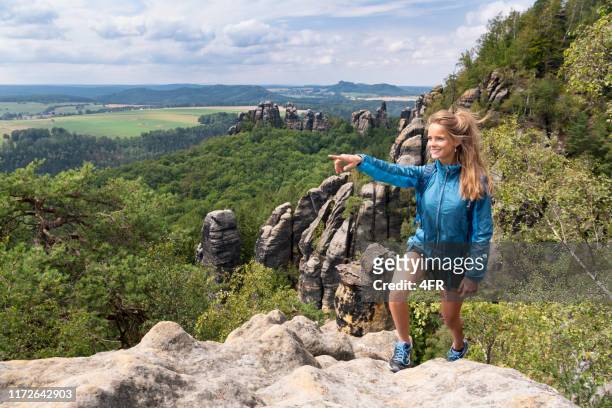 woman hiking, saxon switzerland, elbe sandstone mountains, germany - saxony stock pictures, royalty-free photos & images