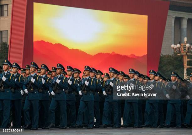 Chinese military march in in formation as they do a last rehearsal before a parade to celebrate the 70th Anniversary of the founding of the People's...