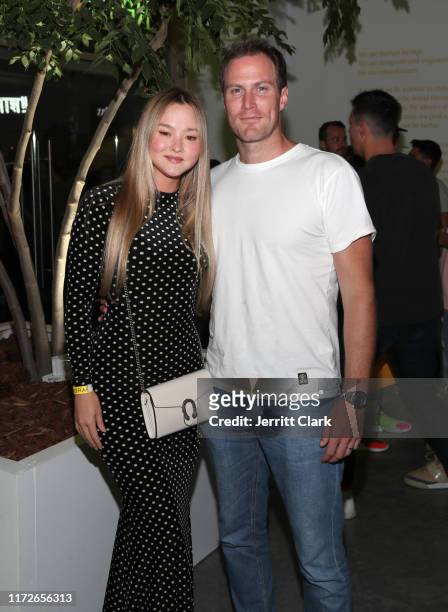 Devon Aoki and James Bailey attend Airgraft's Art Of Clean Vapor Pop-Up Launch Party on September 05, 2019 in Los Angeles, California.