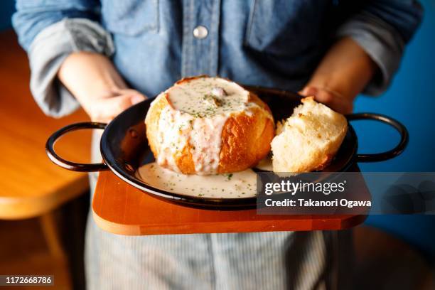 clam chowder in bread - chaudiere stock pictures, royalty-free photos & images