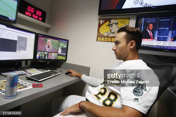 Matt Olson of the Oakland Athletics studies film in the media room prior to the game against the New York Yankees at the Oakland-Alameda County...
