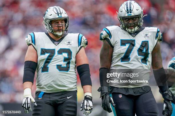 Carolina Panthers offensive guard Greg Van Roten and offensive tackle Greg Little get ready for a play during the football game between the Carolina...