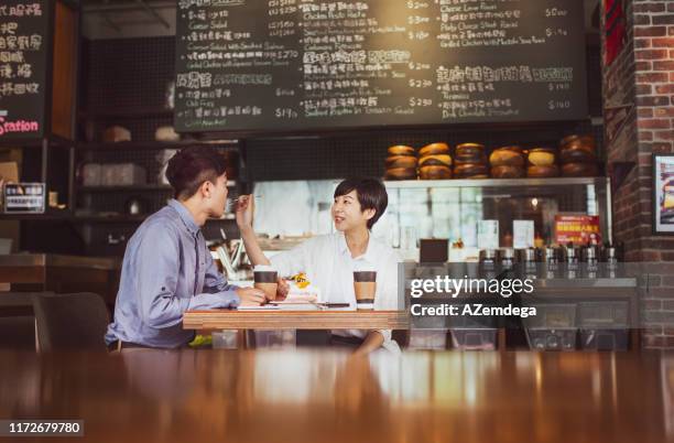 couple in coffee shop - taipei tea stock pictures, royalty-free photos & images