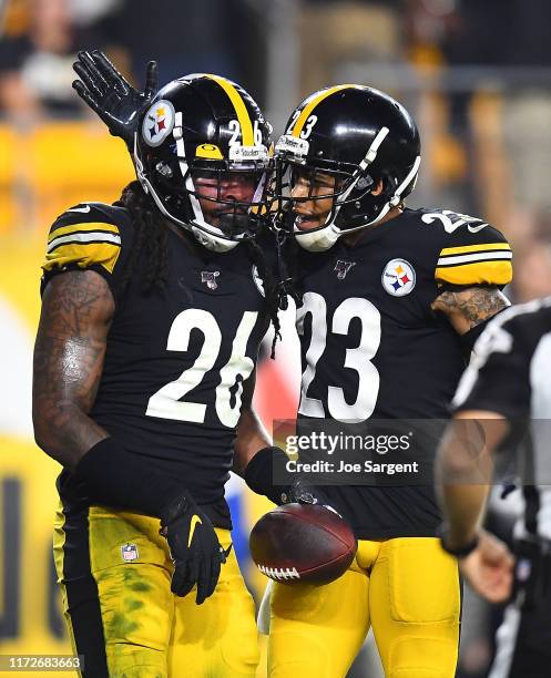 Mark Barron celebrates with Joe Haden of the Pittsburgh Steelers after intercepting a pass during the third quarter against the Cincinnati Bengals at...