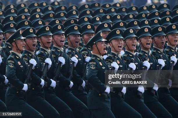 Chinese troops march during a military parade in Tiananmen Square in Beijing on October 1 to mark the 70th anniversary of the founding of the...