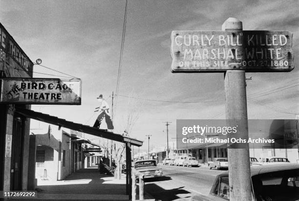 Sign reading 'Curly Bill killed Marshal White on this site - Oct 27 1880' outside the Birdcage Theatre in Tombstone, Arizona, circa 1970. Marshal...