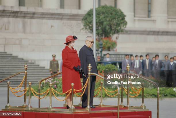 Queen Elizabeth II and Li Xiannian , the President of the People's Republic of China, standing outside the Great Hall of the People in Beijing during...