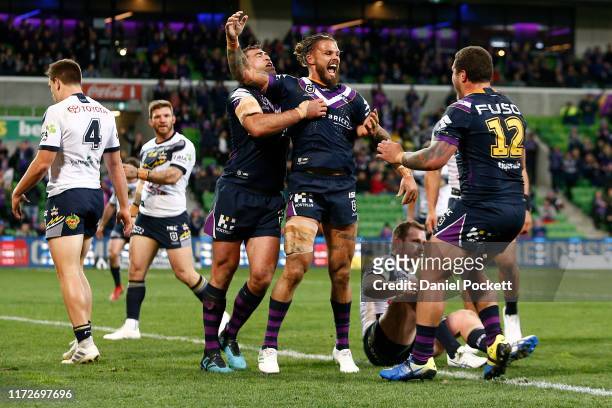 Sandor Earl of the Storm celebrates scoring a try during the round 25 NRL match between the Melbourne Storm and the North Queensland Cowboys at AAMI...