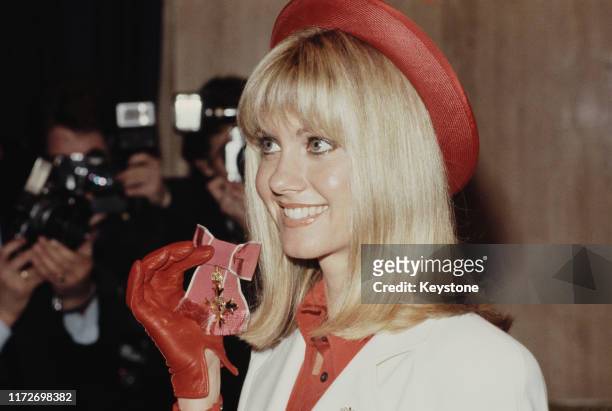 Australian actress and singer Olivia Newton-John receives an OBE at Buckingham Palace in London, UK, 13th March 1979.