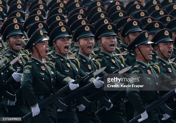 Chinese soldiers shout as they march in formation during a parade to celebrate the 70th Anniversary of the founding of the People's Republic of China...