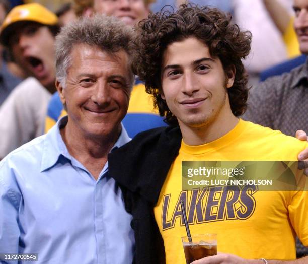 Actor Dustin Hoffman hugs his son Jake before Game One of the NBA Finals between the Los Angeles Lakers and the New Jersey Nets, in Los Angeles, CA,...