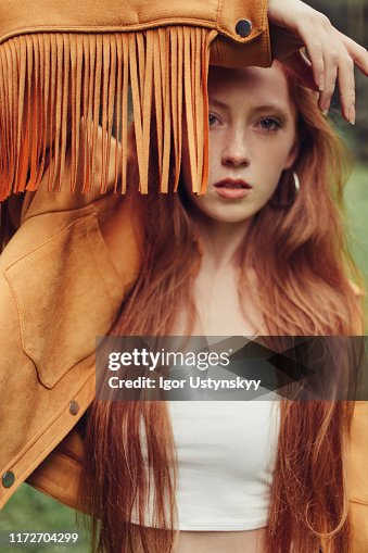 Young girl wearing fringed suede jacket Young girl wearing fringed suede jacket