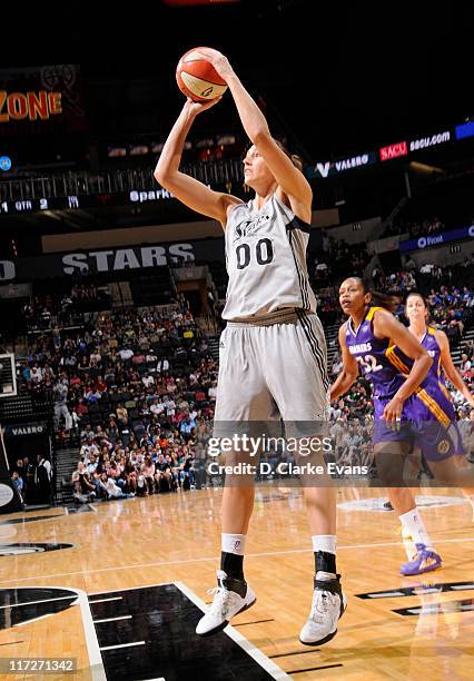 Ruth Riley of the San Antonio Silver Stars shoots against Tina Thompson of the Los Angeles Sparks at the AT&T Center on June 24, 2011 in San Antonio,...