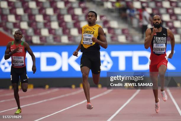 Kenya's Alphas Leken Kishoyian, Jamaica's Akeem Bloomfield and Trinidad and Tobago's Machel Cedenio compete in the Men's 400m heats at the 2019 IAAF...