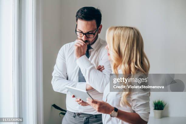 businessman and businesswoman on a meeting - contemplation couple stock pictures, royalty-free photos & images