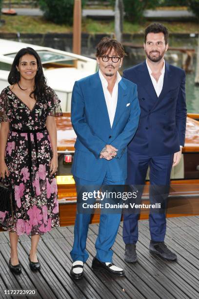 Olga Segura, Johnny Depp and Andrea Iervolino seen arriving at the 76th Venice Film Festival on September 06, 2019 in Venice, Italy.