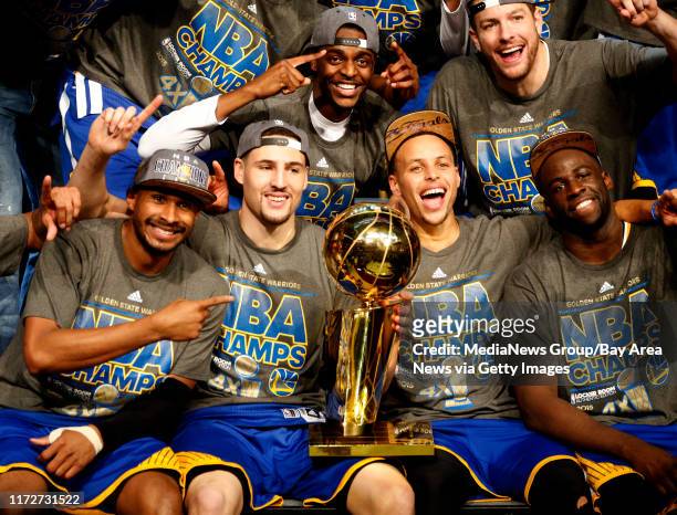 The Golden State Warriors, including Golden State Warriors' Klay Thompson and Golden State Warriors' Stephen Curry celebrates with the NBA...