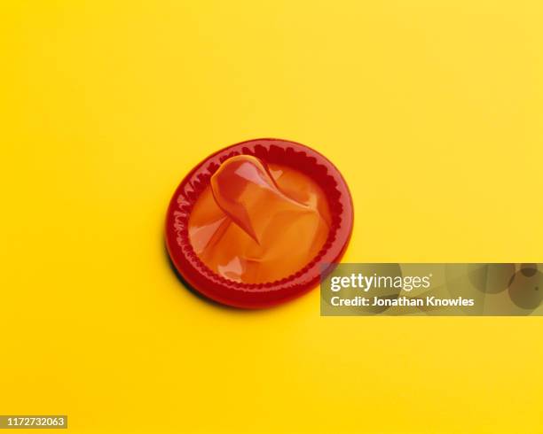 red condom - condoms imagens e fotografias de stock