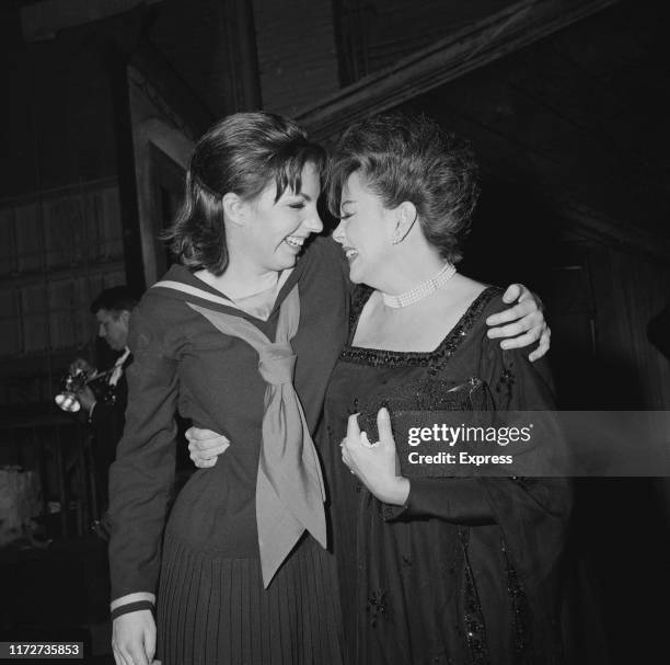 American actress and singer Liza Minnelli with her mother, American actress and singer Judy Garland , backstage after she opened in 'Flora the Red...