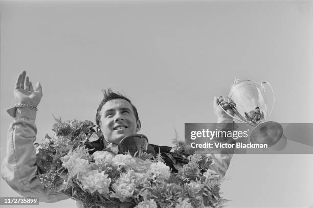 British Formula One driver Jackie Stewart celebrate his victory at the Daily Express International Trophy race at Silverstone Circuit, UK, 15th May...
