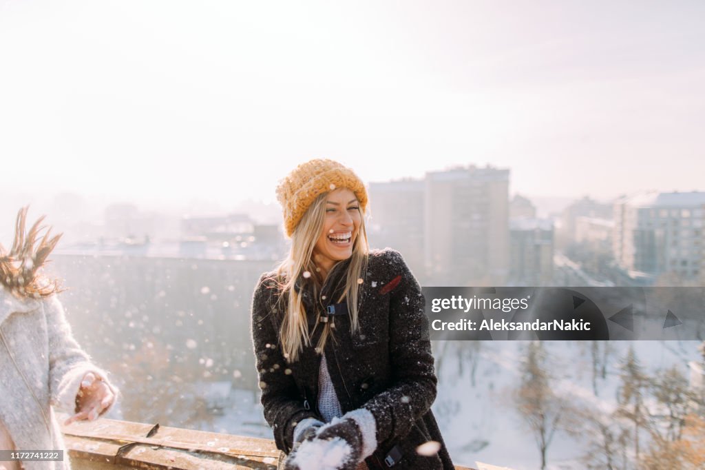 Young woman enjoys snowy winter