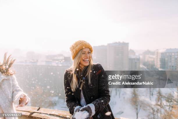 young woman enjoys snowy winter - winter stock pictures, royalty-free photos & images