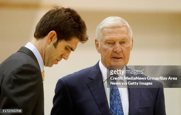 Golden State Warriors general manager Bob Myers, left, talks with board member Jerry West, right, during media day on Monday, Oct. 1, 2012 in...
