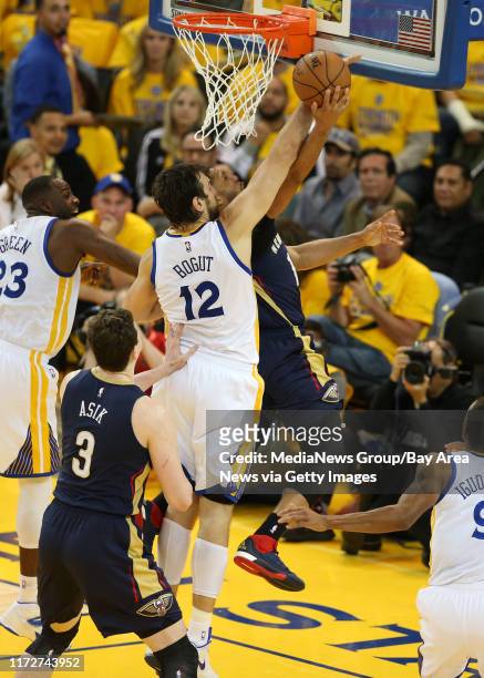Golden State Warriors' Andrew Bogut tries to block a shot against New Orleans Pelicans' Ryan Anderson in the third quarter of Game 2 of the first...