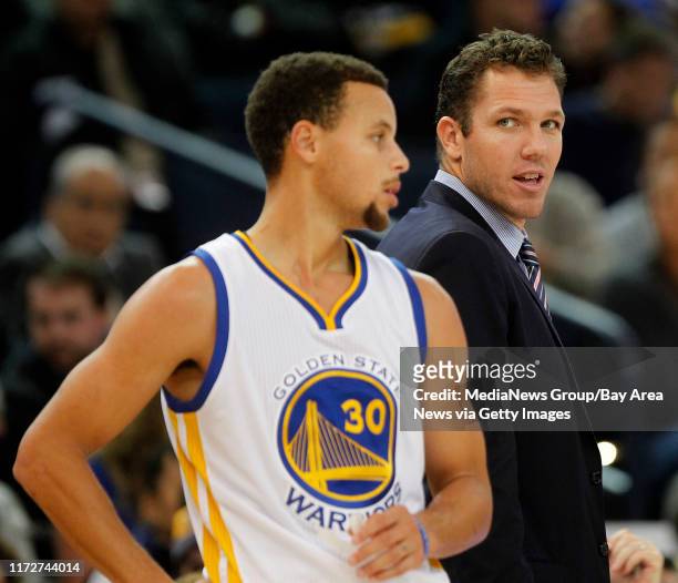 Golden State Warriors interim head coach Luke Walton and guard Stephen Curry are photographed during their win over the Detroit Pistons on Monday,...