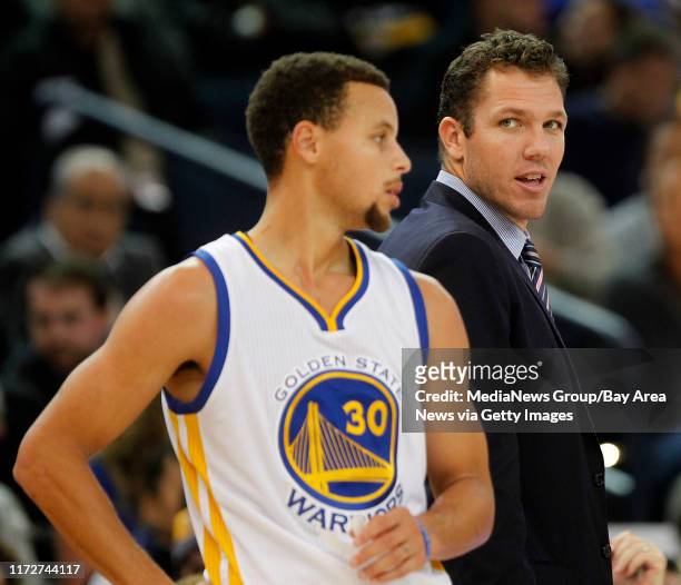 Golden State Warriors interim head coach Luke Walton and guard Stephen Curry are photographed during their win over the Detroit Pistons on Monday,...