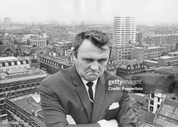 English comedian Les Dawson scowls on a rooftop, 18th August 1967.