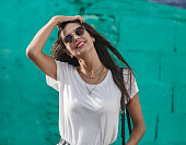 Beautiful brunette female model in dark sunglasses