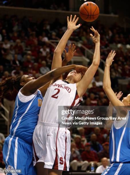 Stanford Cardinal's Jayne Appel tries to get a shot off against UCLA Bruins Regina Rogers in the first half for their semi-final game for the 2008...