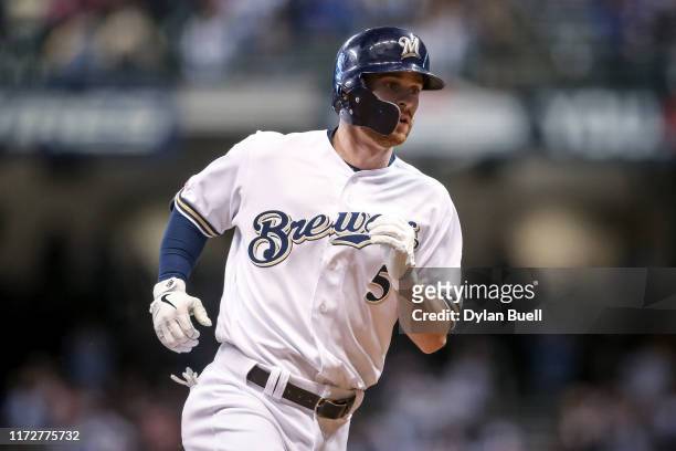 Cory Spangenberg of the Milwaukee Brewers rounds the bases after hitting a home run in the sixth inning against the Chicago Cubs at Miller Park on...