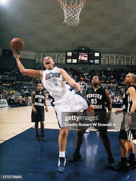 University of Connecticut basketball player of year Diana Taurasi with the ball under the net during a game against Western Michigan University,...